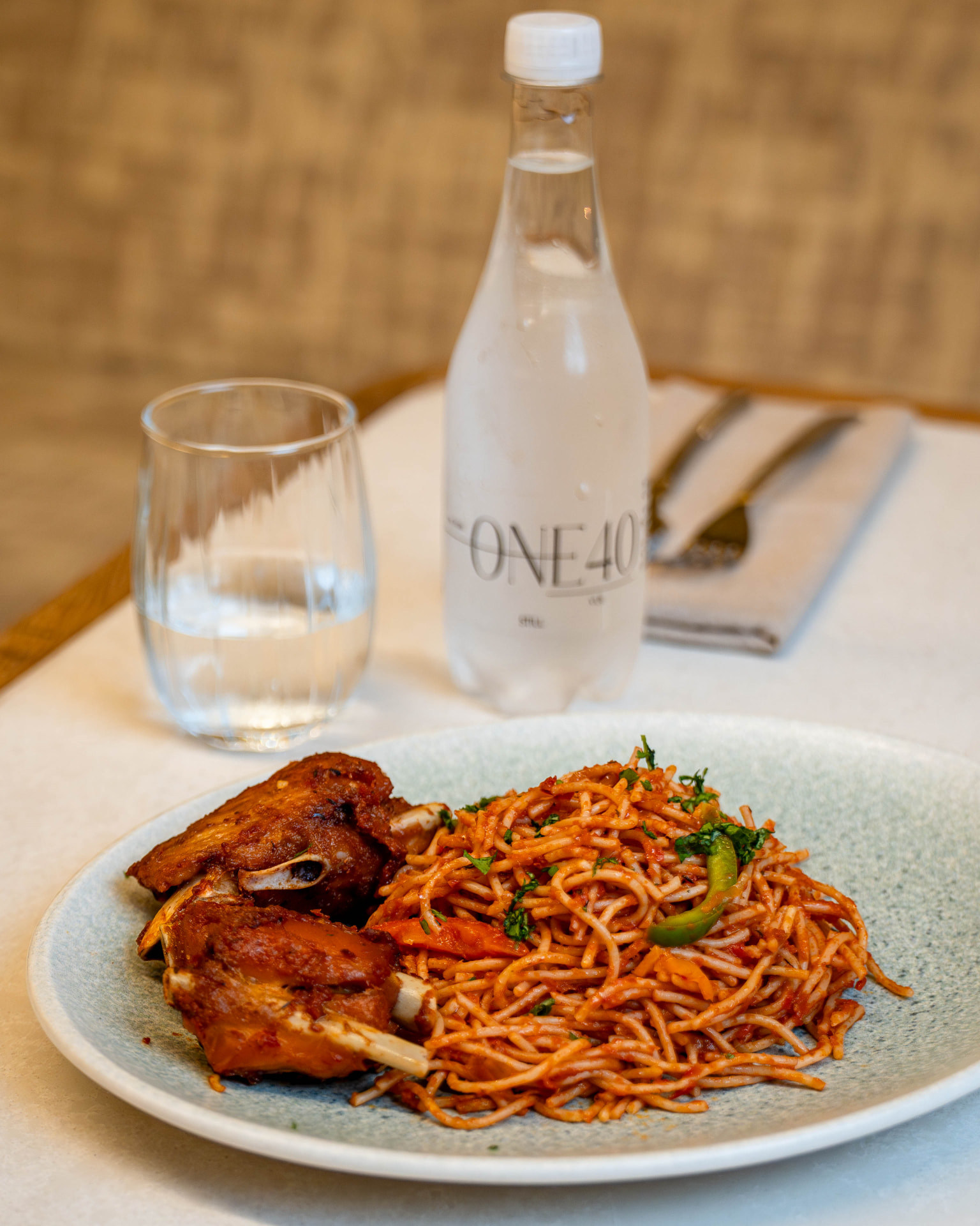 Spiced tomato spaghetti served with grilled chicken